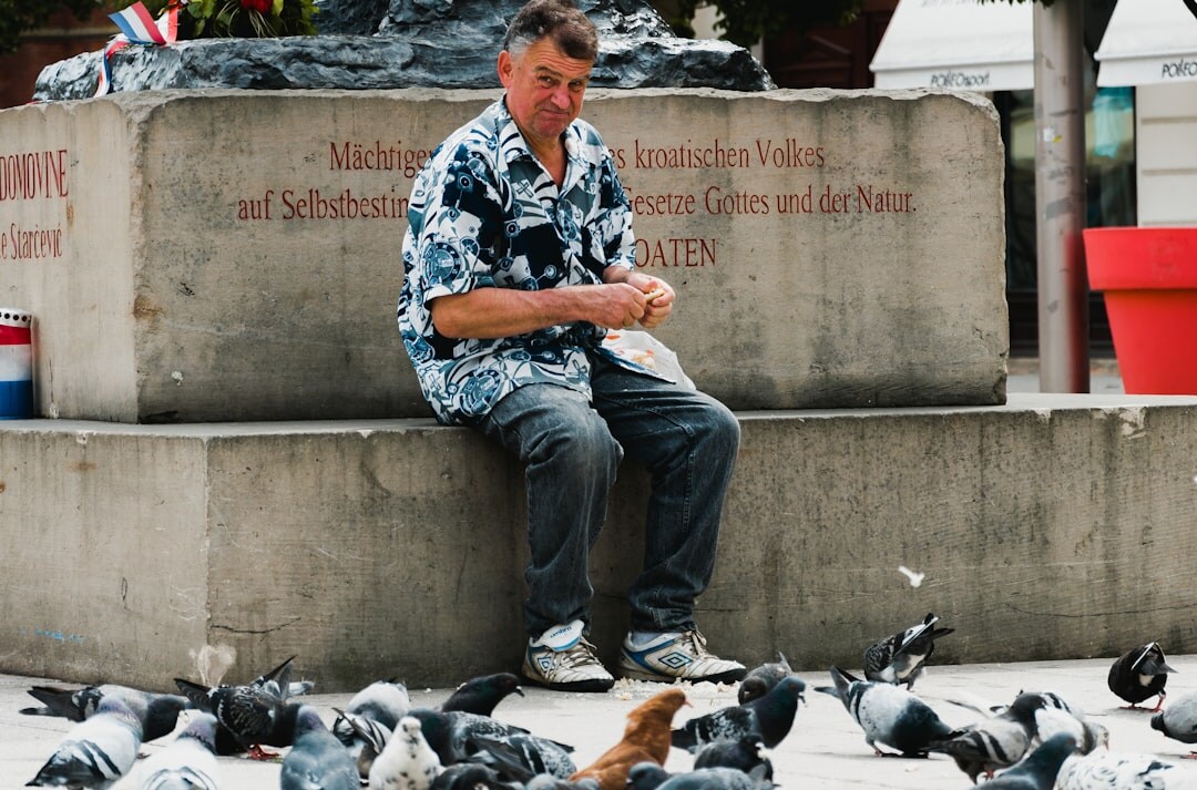 Journalist writing notes during an interview with a villager in Croatia