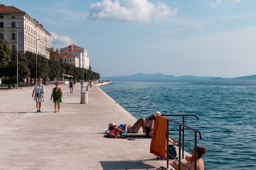 Croatian family looking together at a printed photo story